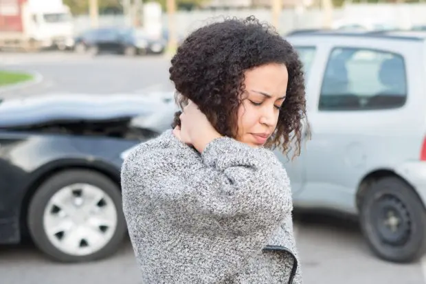 Injured woman feeling bad after having car crash