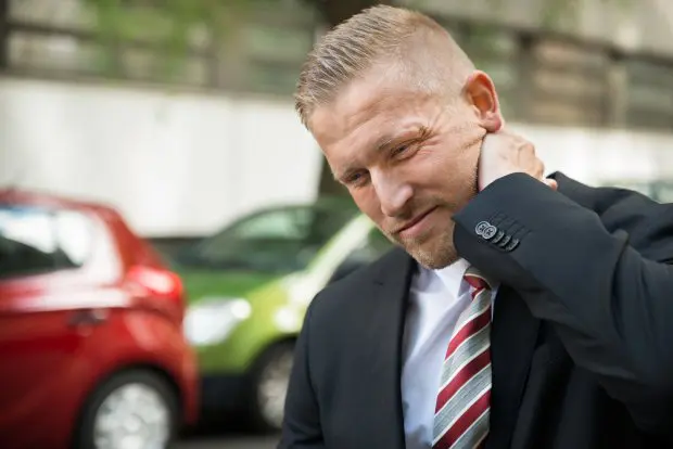 Young Man Having Neck Pain