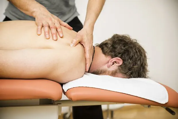 young man at the physio therapy