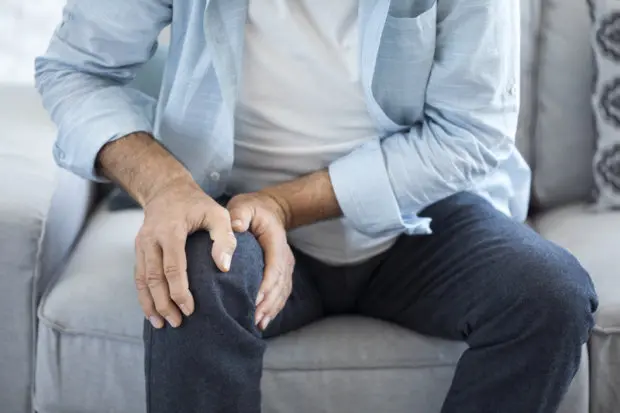 A man experiencing knee pain.