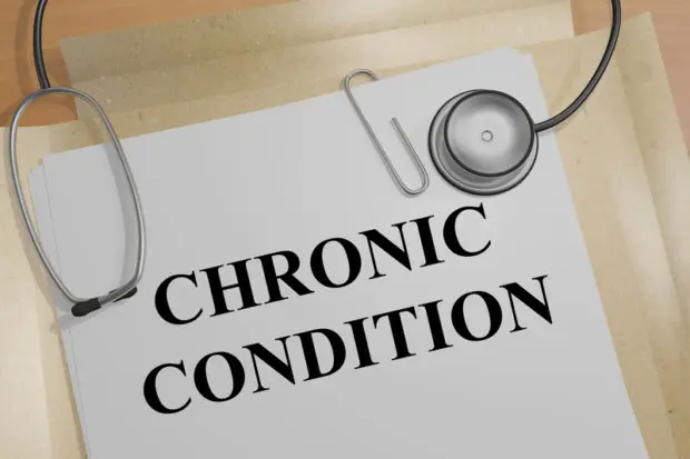 Paper that says chronic condition and a stethoscope on top of it.