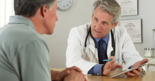 Patient talking to a doctor about their chronic condition.
