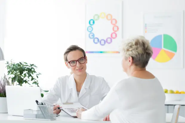 Woman having a health consultation with a medical professional.