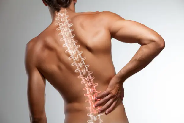 View of a man's back with his spine and back pain highlighted.