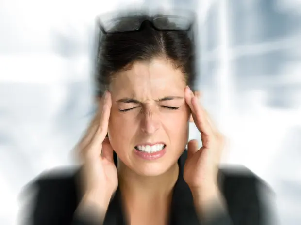 Woman who is having a sudden onset of a migraine.
